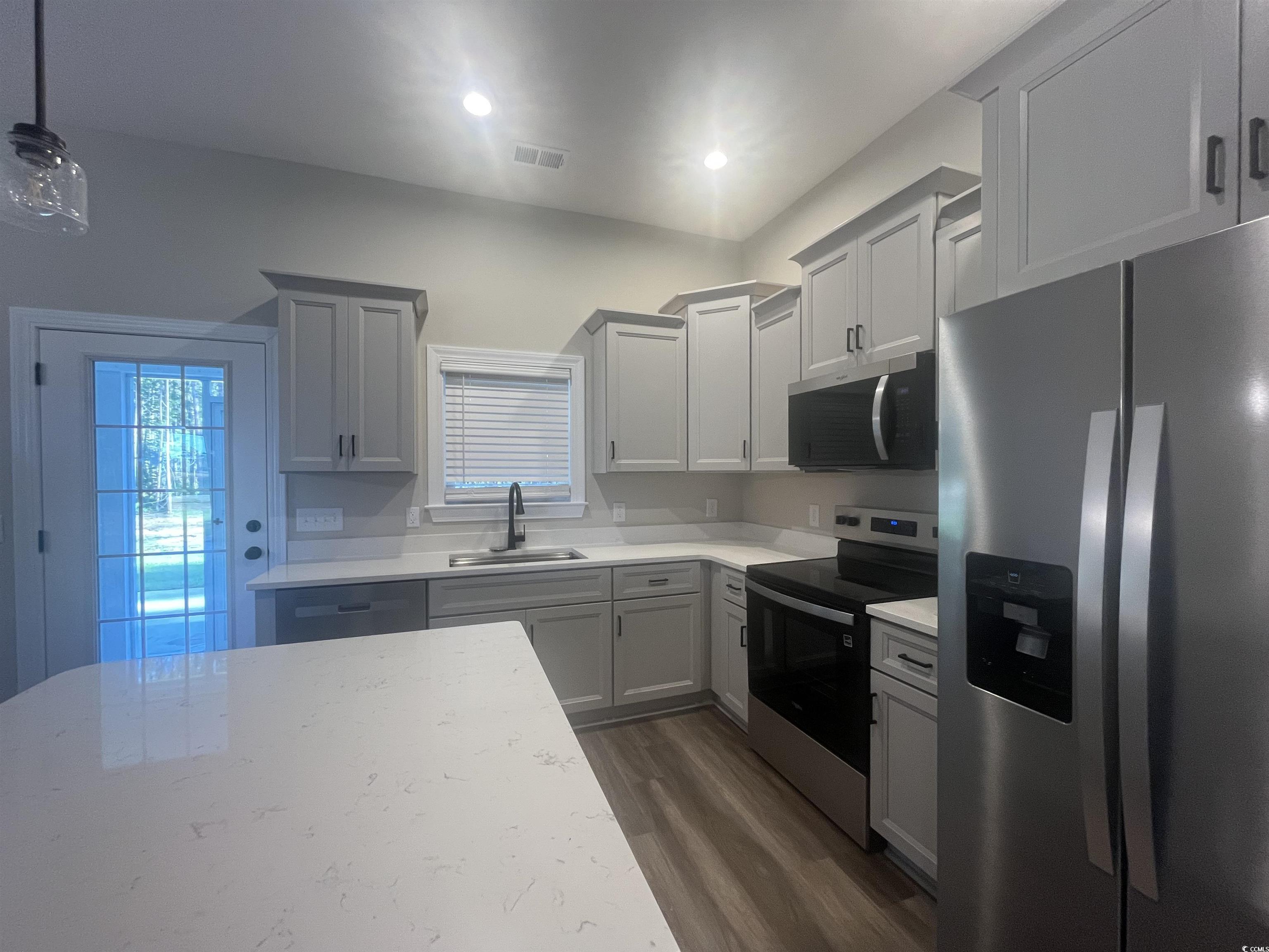 2925 Hughes Gasque Road Aynor, SC 29511 - Photo 4 of 12 Kitchen with stainless steel appliances, dark wood