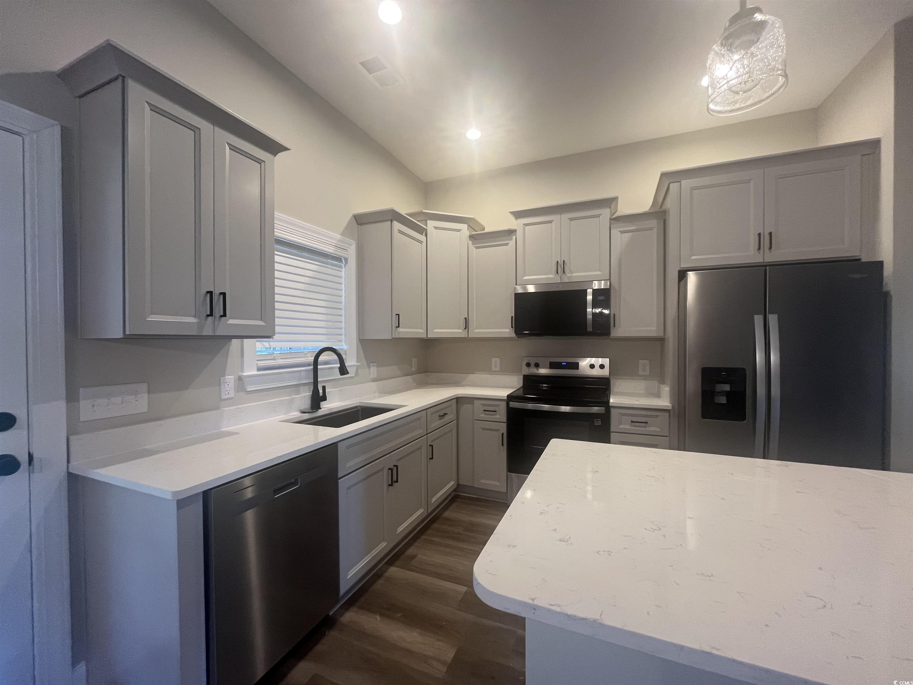2925 Hughes Gasque Road Aynor, SC 29511 - Photo 5 of 12 Kitchen with stainless steel appliances, dark wood