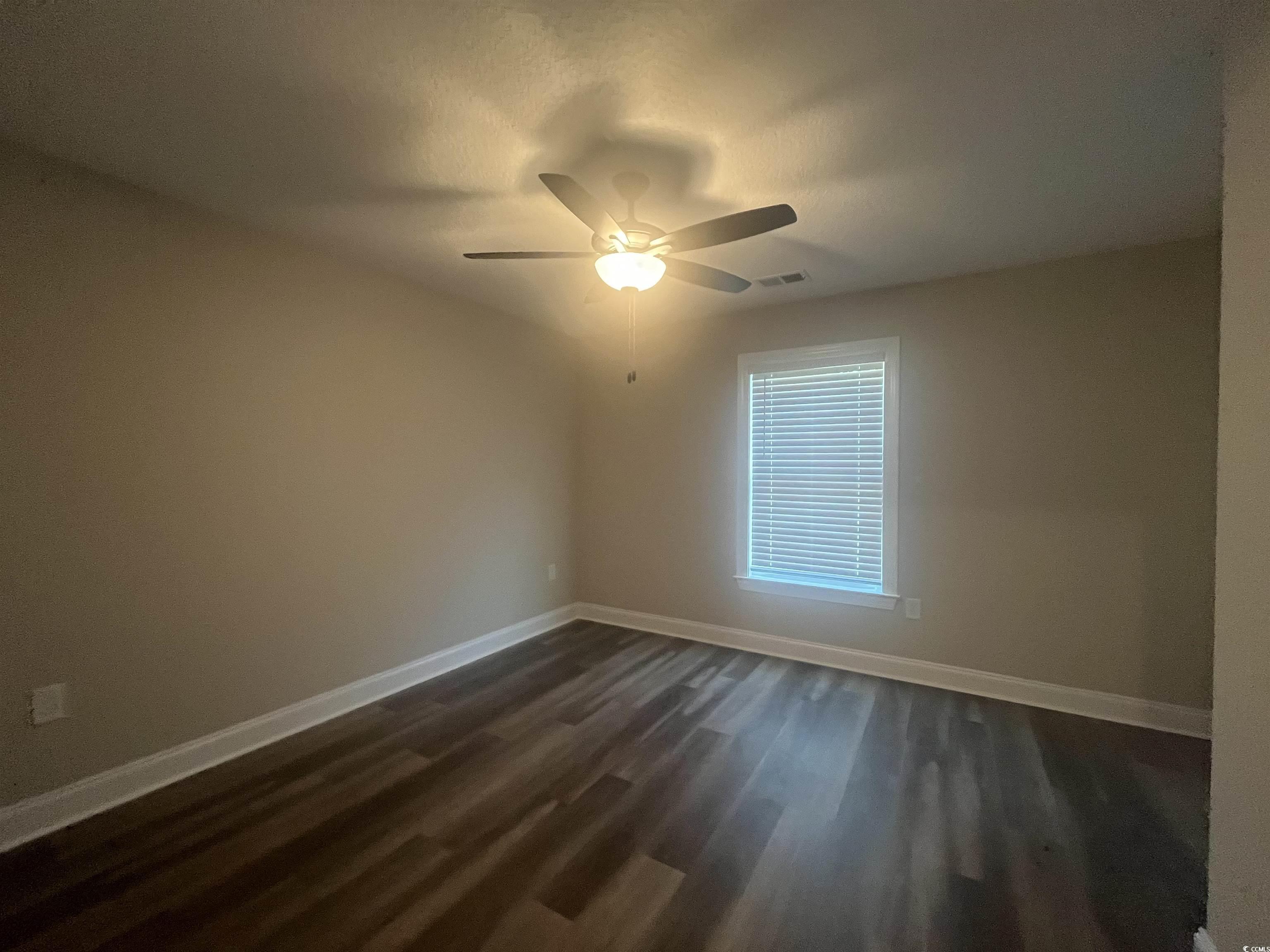 2925 Hughes Gasque Road Aynor, SC 29511 - Photo 9 of 12 Spare room featuring dark wood finished floors and