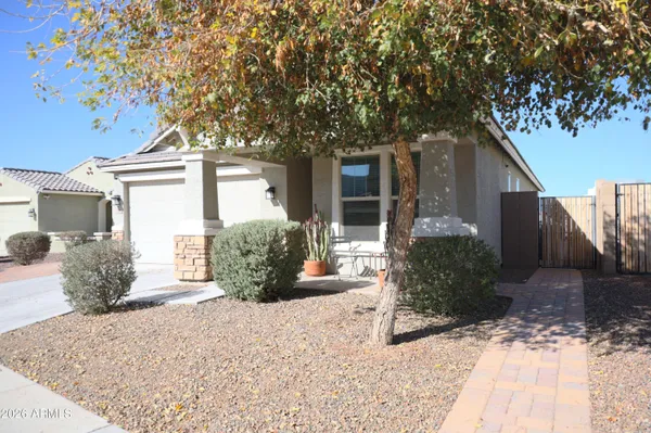 a front view of a house with garden