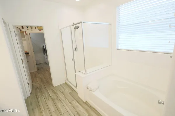 a terrace of a house with wooden floor and outdoor seating