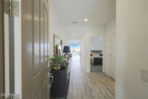 a bedroom with a bed and a night stand