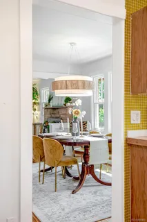 a kitchen with stainless steel appliances granite countertop hardwood floor sink stove and wooden cabinets