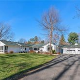 a view of house with garden