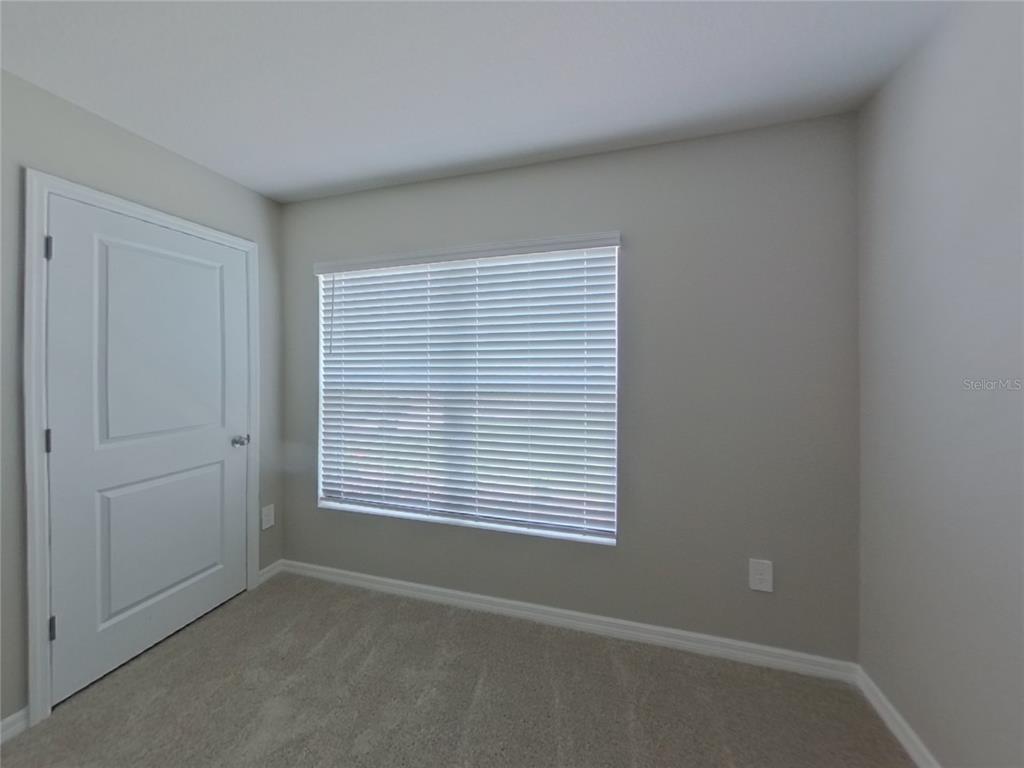 10844 Gentle Current Way Parrish, FL 34219 - Photo 11 of 17 a view of an empty room with a window