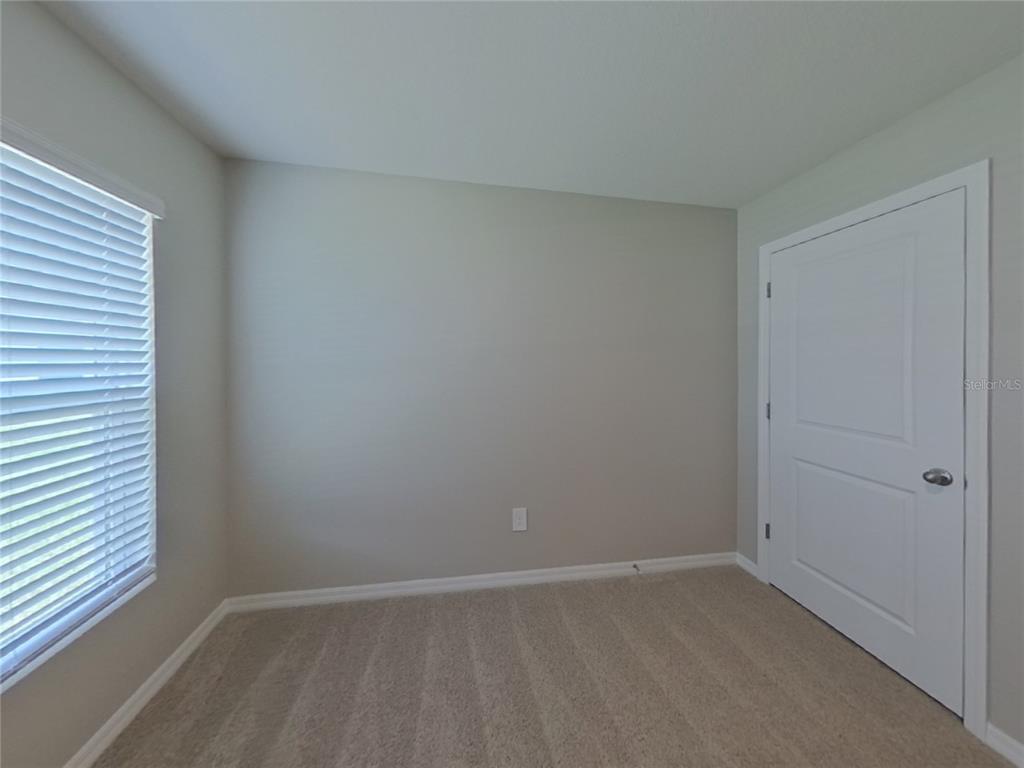 10844 Gentle Current Way Parrish, FL 34219 - Photo 14 of 17 a view of an empty room with a window