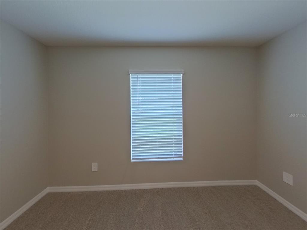10844 Gentle Current Way Parrish, FL 34219 - Photo 15 of 17 an empty room with a window