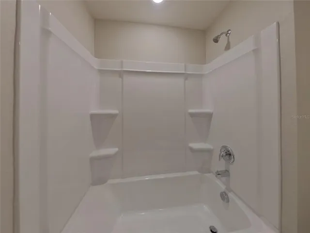 a close view of a bathtub in bathroom
