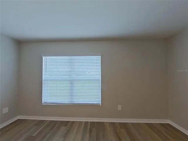 a view of a room that has a window in it