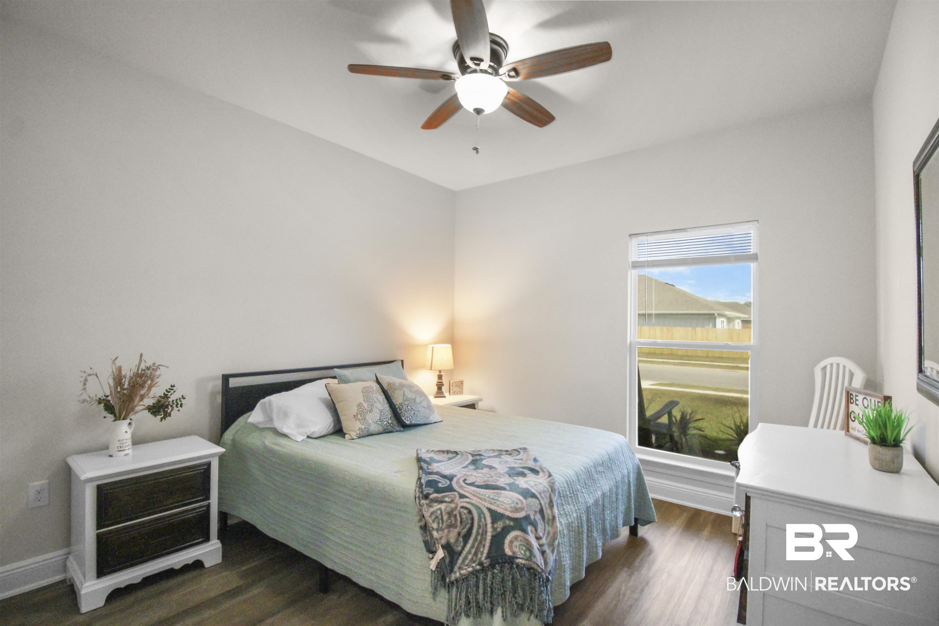 12523 Pheasant Run Elberta, AL 36530 - Photo 23 of 43 Bedroom featuring dark wood-style flooring and a ceiling fan