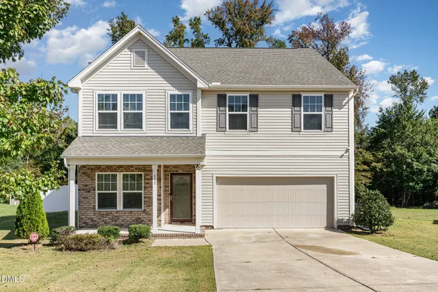 front view of a house and a yard