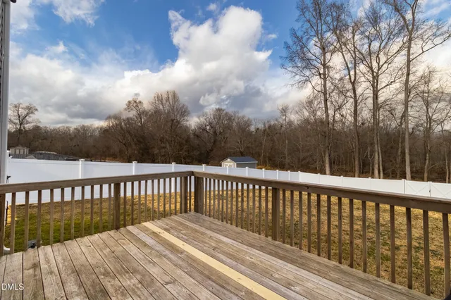 a view of balcony with wooden floor