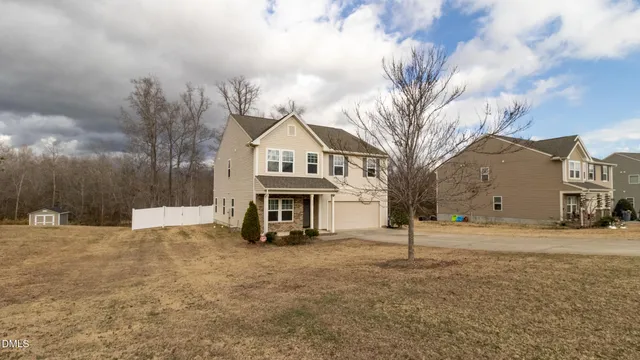 a view of a house with a snow in front of it