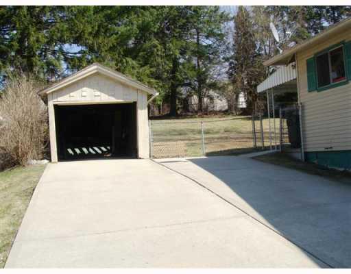 128 Rochester Road Pittsburgh, PA 15229 - Photo 2 of 14 Exterior Front. Spacious concrete driveway with covered parking.