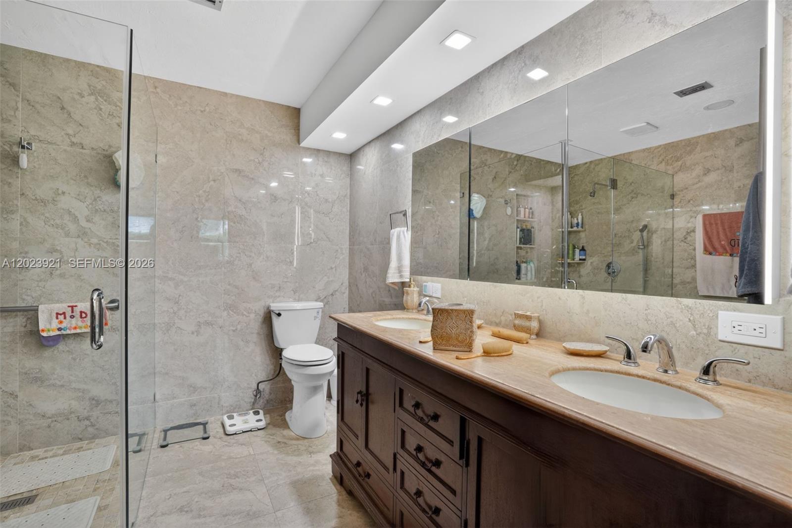 8461 Southwest 68th St Road Miami, FL 33143 - Photo 64 of 65 a bathroom with a double vanity sink mirror and double