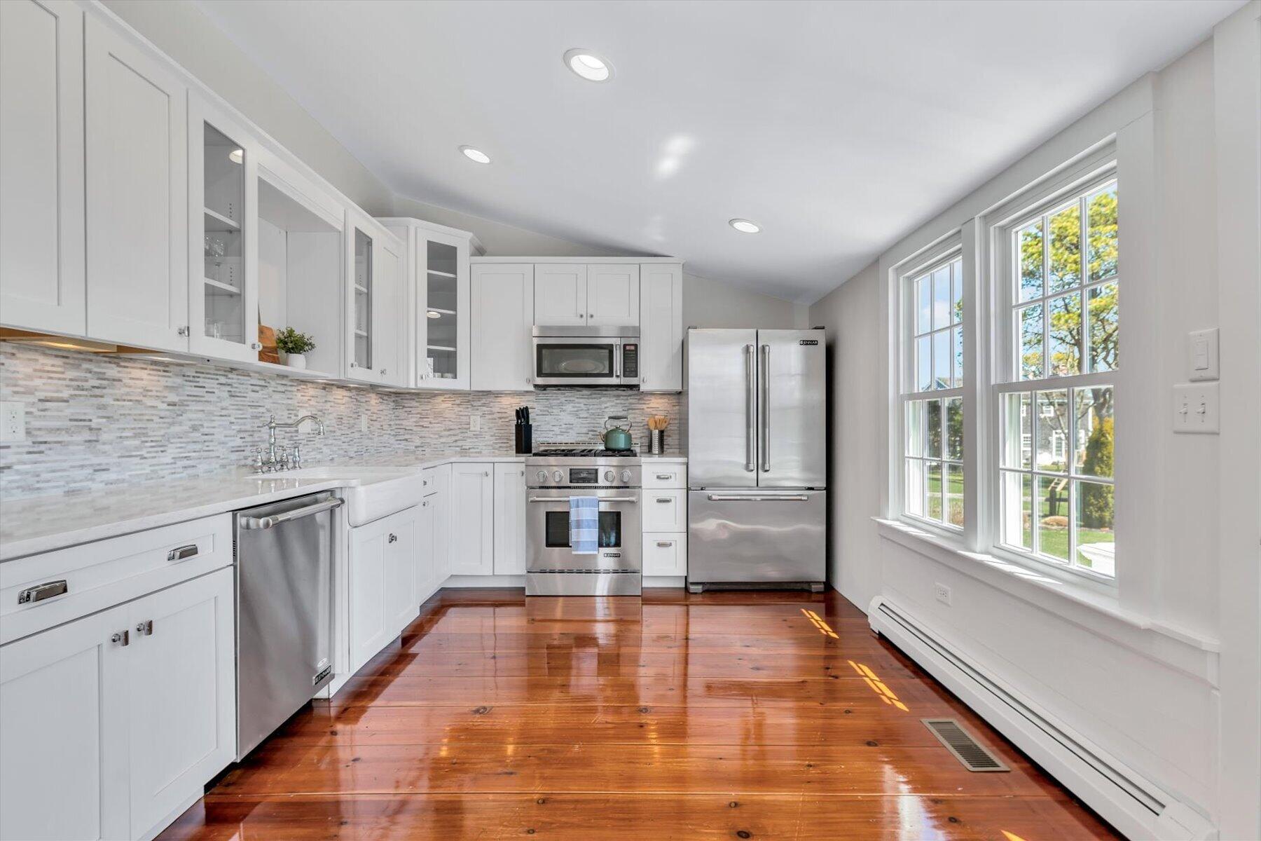 25 Riverside Drive West Harwich, MA 02671 - Photo 14 of 41 a kitchen with stainless steel appliances granite countertop a stove a sink and a microwave
