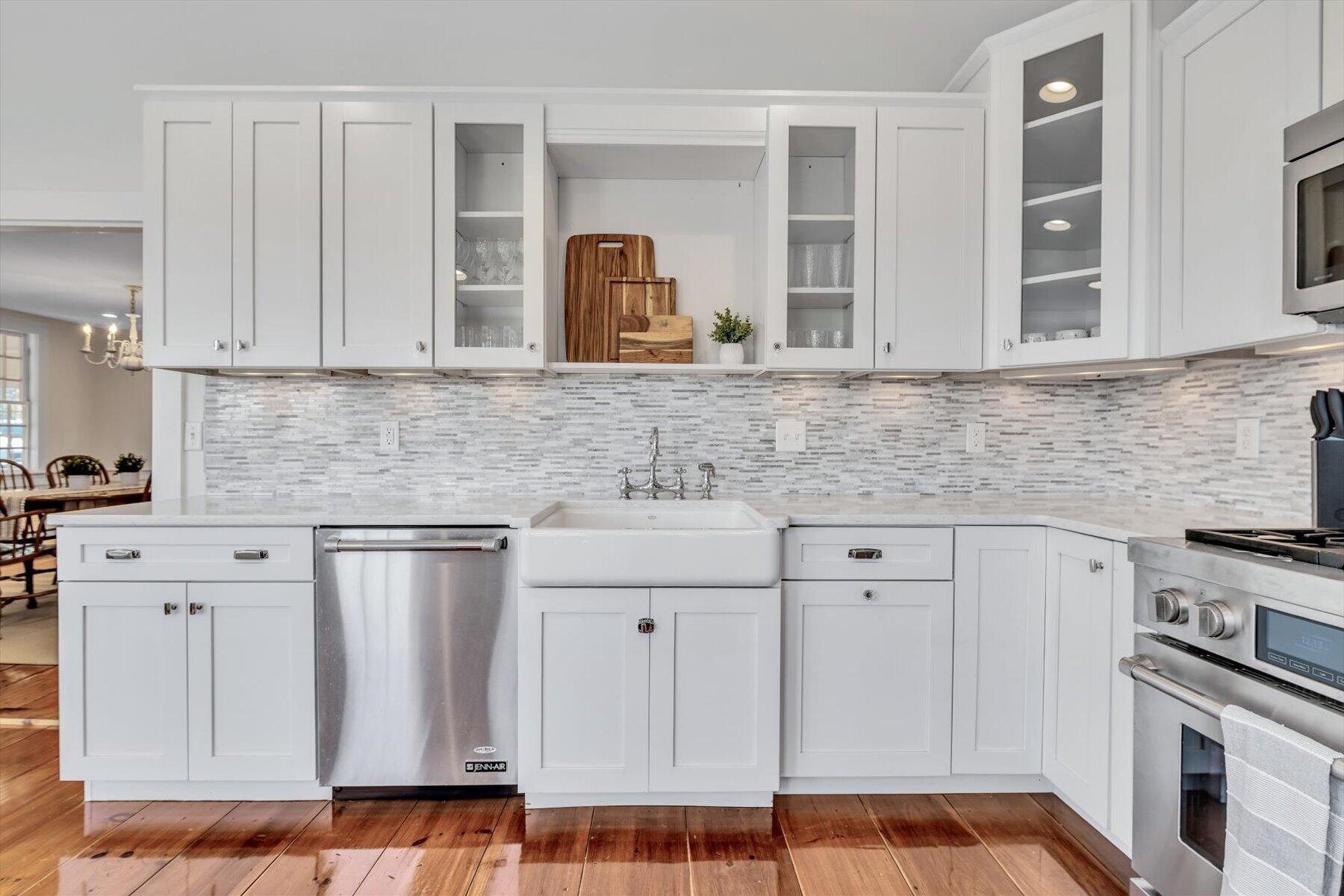 25 Riverside Drive West Harwich, MA 02671 - Photo 15 of 41 a kitchen with white cabinets and sink