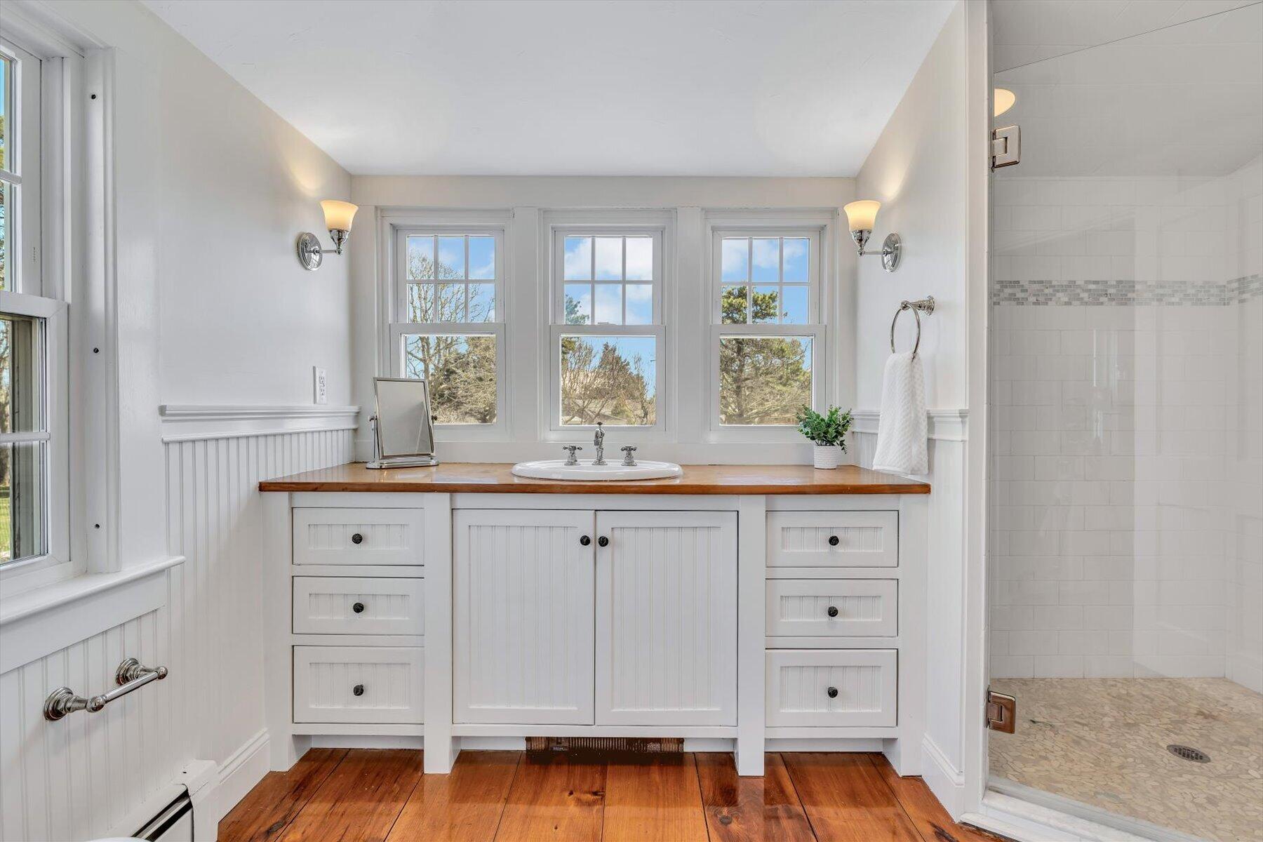 25 Riverside Drive West Harwich, MA 02671 - Photo 25 of 41 a spacious bathroom with a double vanity sink a mirror and a shower