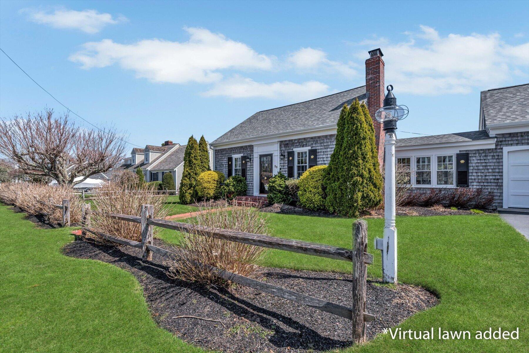 25 Riverside Drive West Harwich, MA 02671 - Photo 32 of 41 a front view of a house with a yard