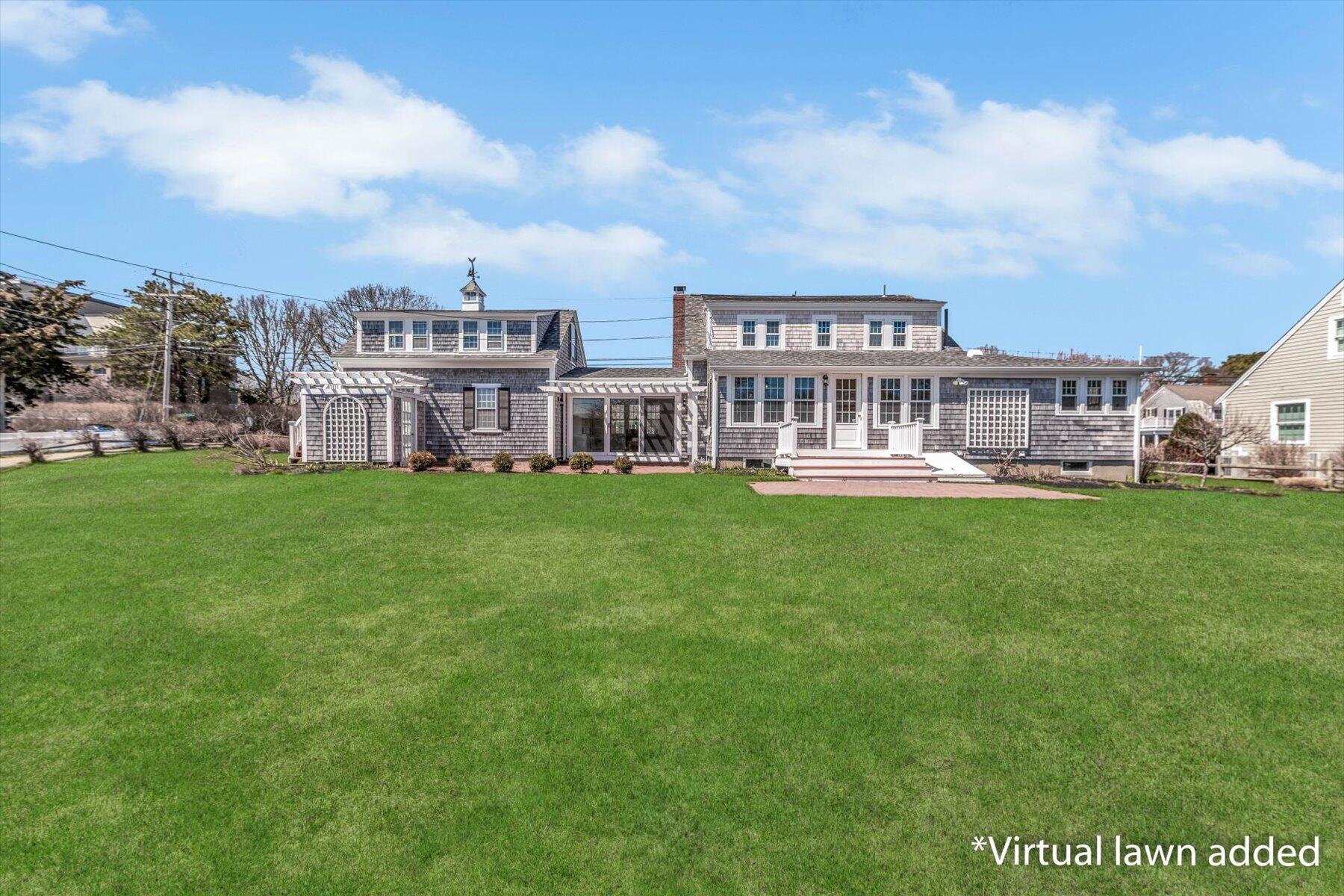 25 Riverside Drive West Harwich, MA 02671 - Photo 34 of 41 a view of a house with a big yard and large trees