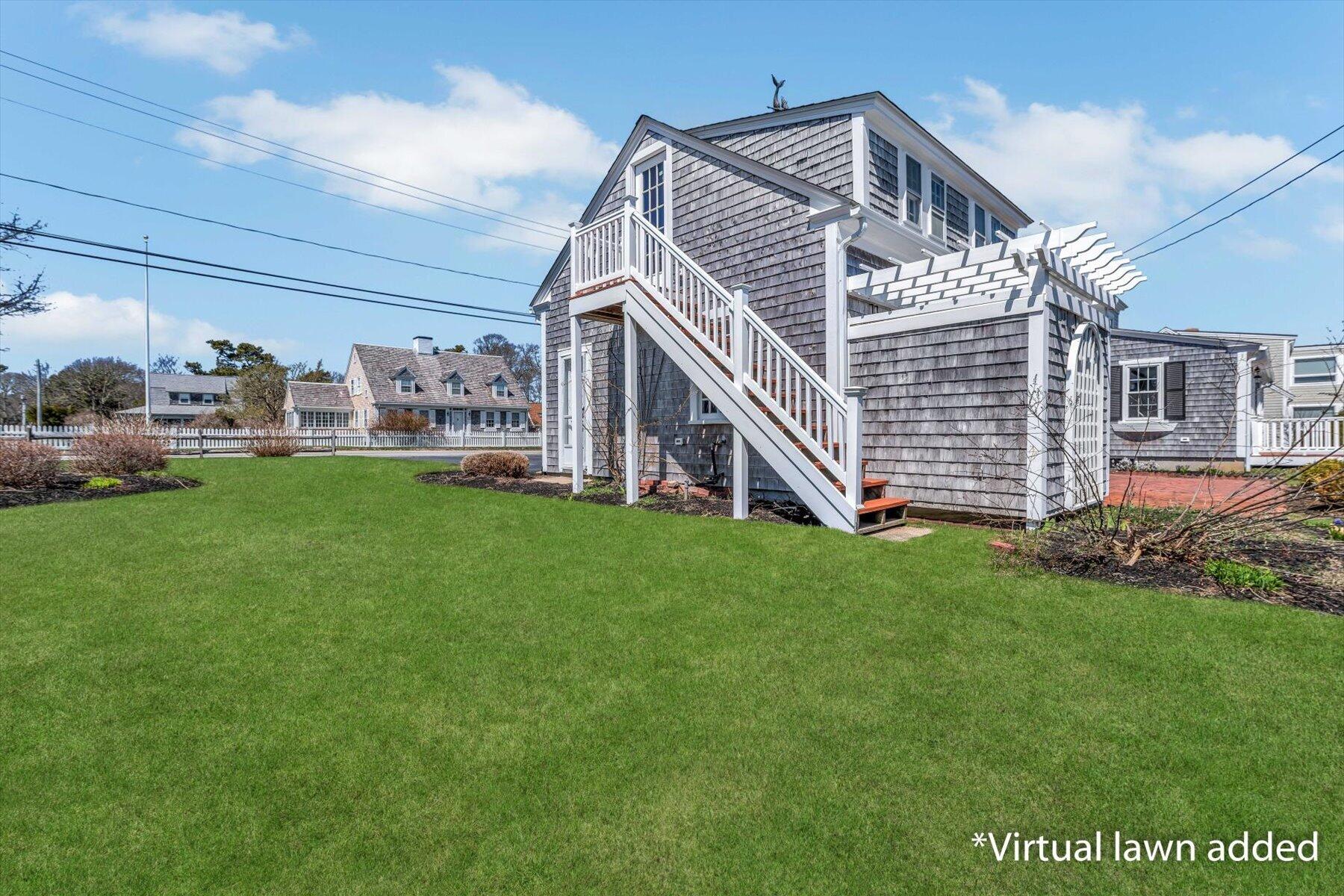 25 Riverside Drive West Harwich, MA 02671 - Photo 36 of 41 a front view of a house with a garden and deck