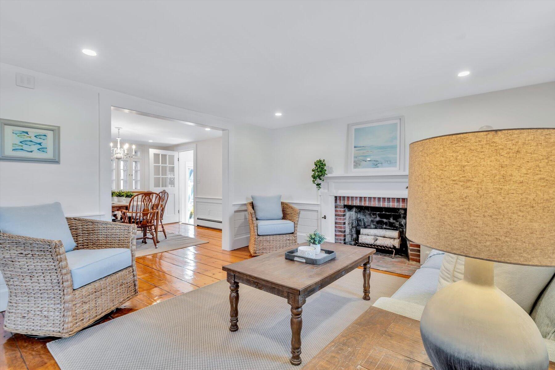 25 Riverside Drive West Harwich, MA 02671 - Photo 7 of 41 a living room with furniture and a fireplace