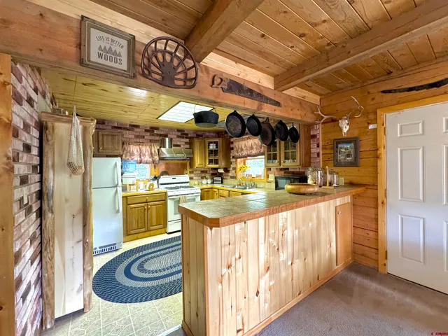 a bedroom with a bed and a flat tv screen