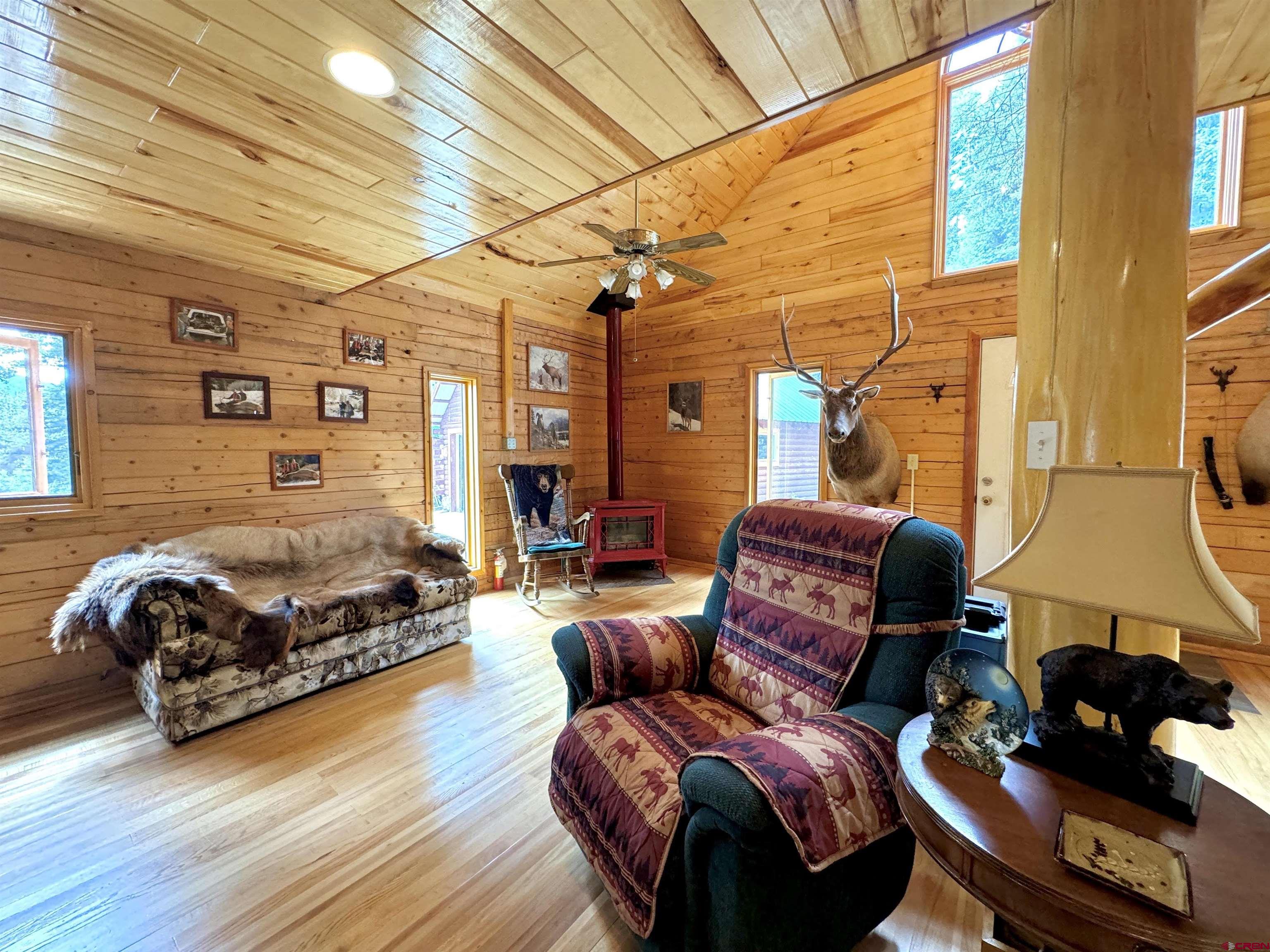 0 Forest Road Del Norte, CO 81132 - Photo 15 of 40 a living room with furniture and a fireplace
