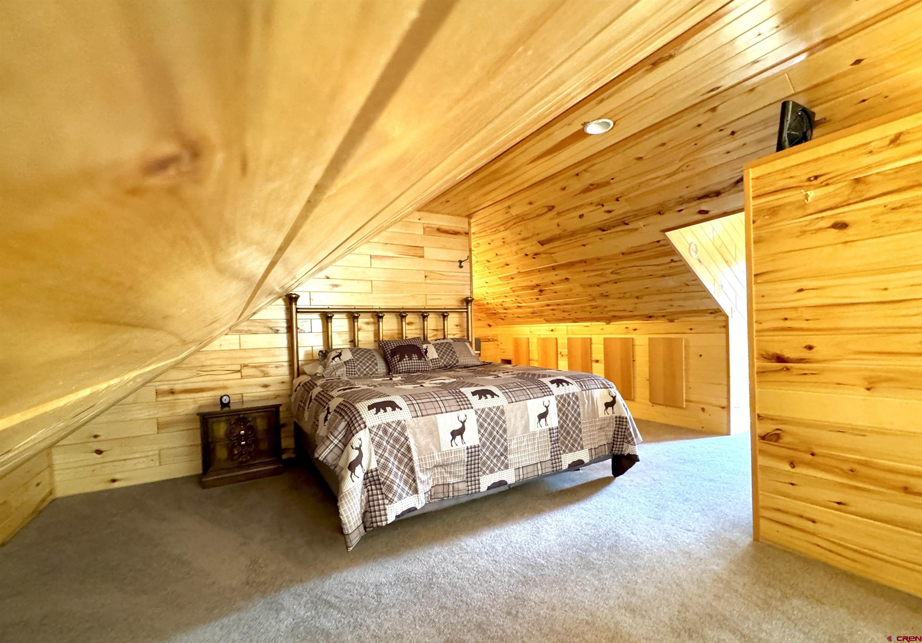 0 Forest Road Del Norte, CO 81132 - Photo 20 of 40 a blue and white bed sitting in a room next to a window