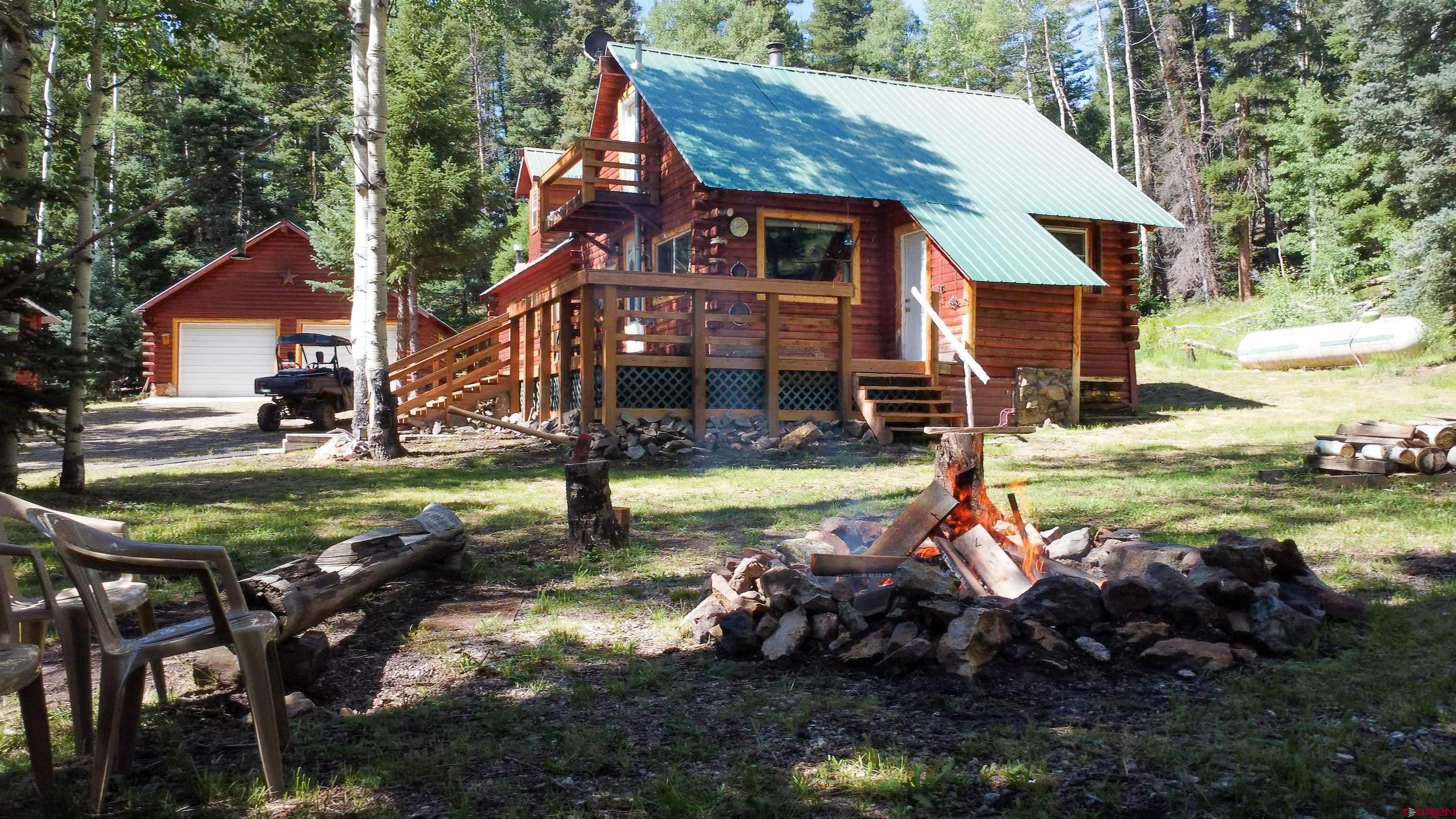 0 Forest Road Del Norte, CO 81132 - Photo 6 of 40 a view of a house with backyard and sitting area