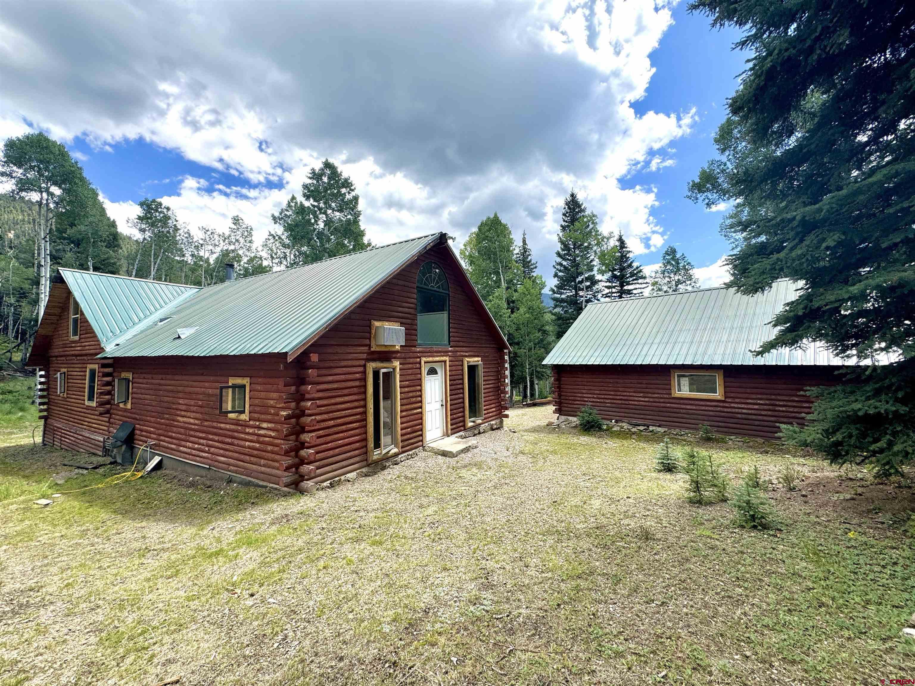 0 Forest Road Del Norte, CO 81132 - Photo 9 of 40 a view of a house with a yard