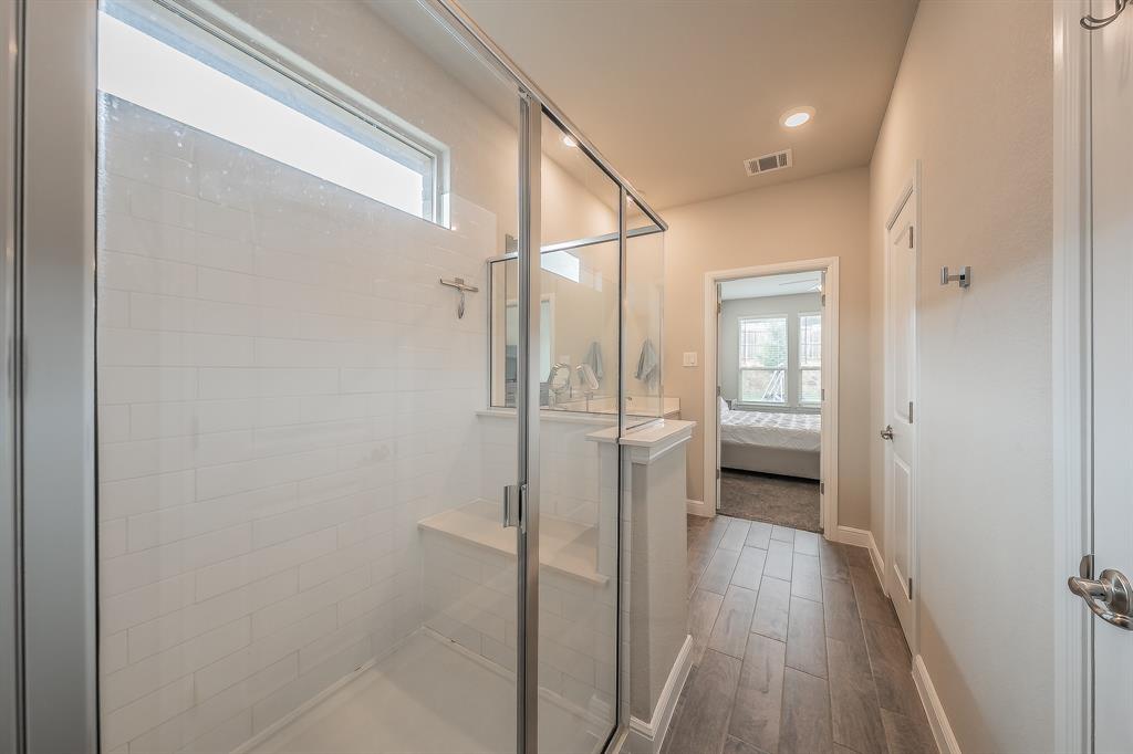 1212 Bosque Lane Weatherford, TX 76087 - Photo 29 of 38 a bathroom with a glass shower door
