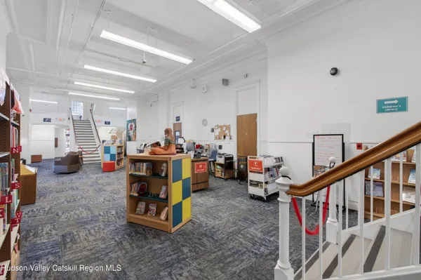 a living room with lots of furniture and a chandelier