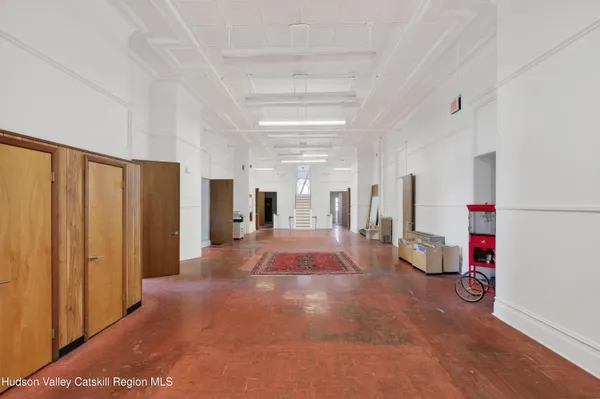 a view of game room with windows