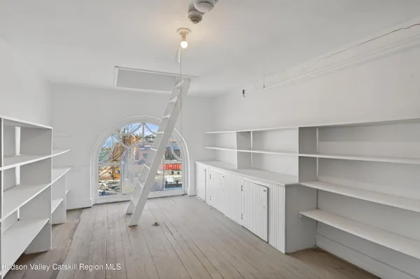 a view of a room with racks on the wall