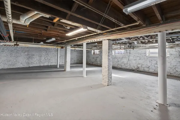a view of a room with wooden walls