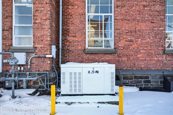 a front view of a building with parking