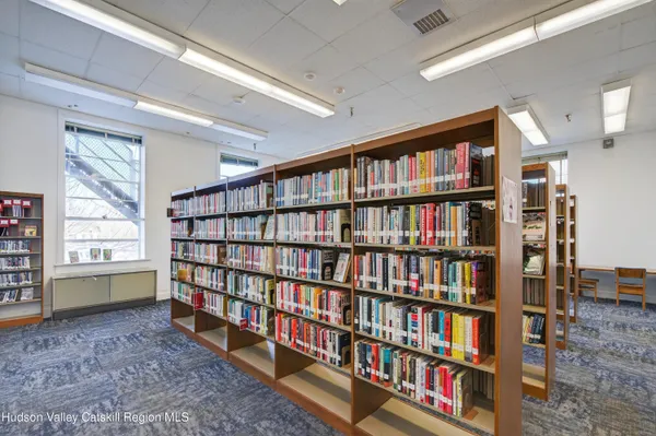a living room with lots of books