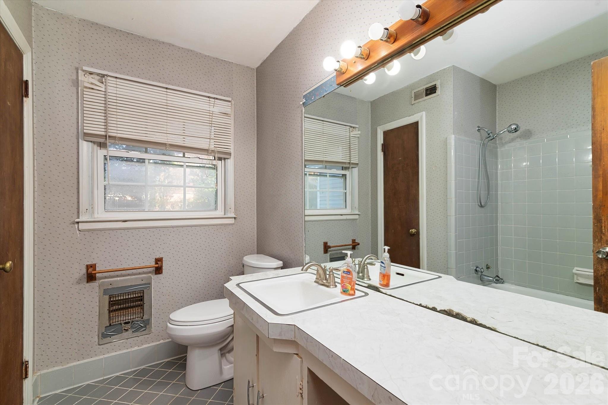 1736 Ebinport Road Rock Hill, SC 29732 - Photo 16 of 34 a bathroom with a granite countertop sink toilet and mirror