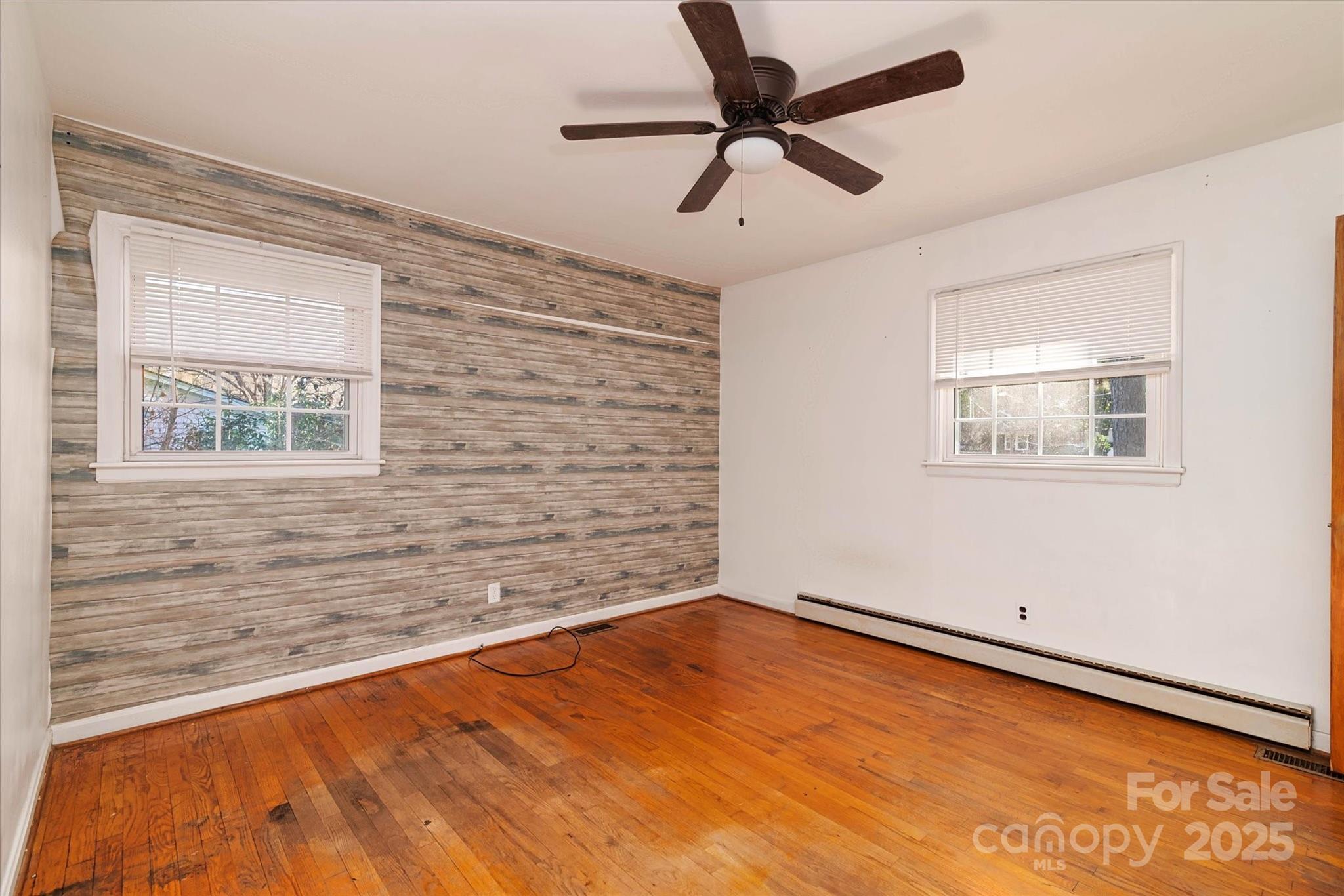 1736 Ebinport Road Rock Hill, SC 29732 - Photo 18 of 35 a view of a big room with wooden floor and windows