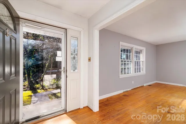 a view of an empty room with a window