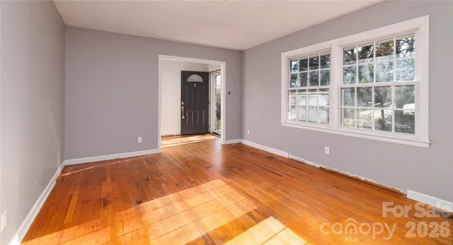 a kitchen with a sink window and cabinets