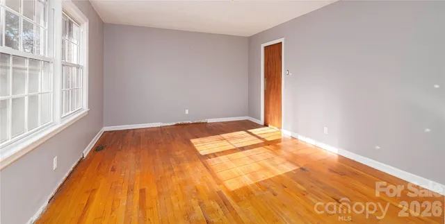 a kitchen with stainless steel appliances granite countertop a refrigerator and cabinets