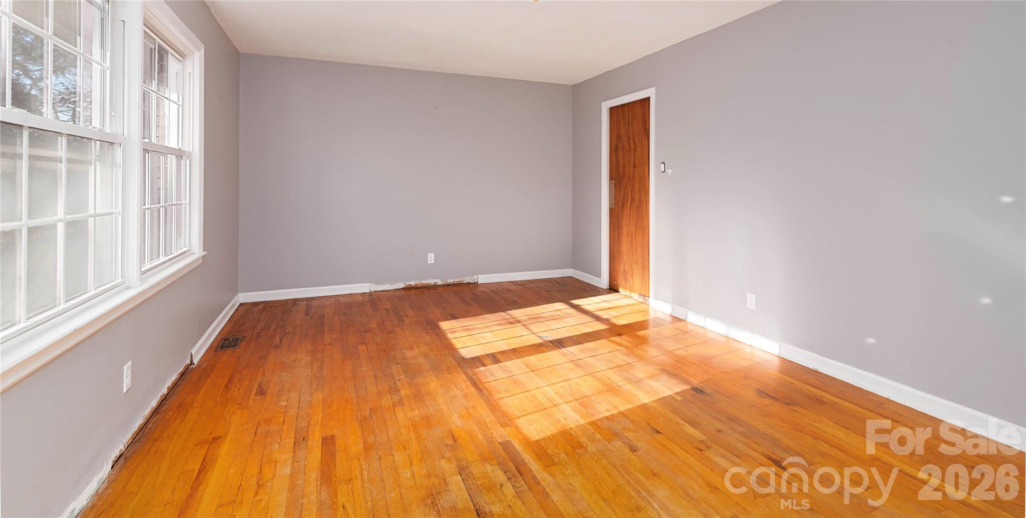 1736 Ebinport Road Rock Hill, SC 29732 - Photo 5 of 34 a view of a room with wooden floor and a window