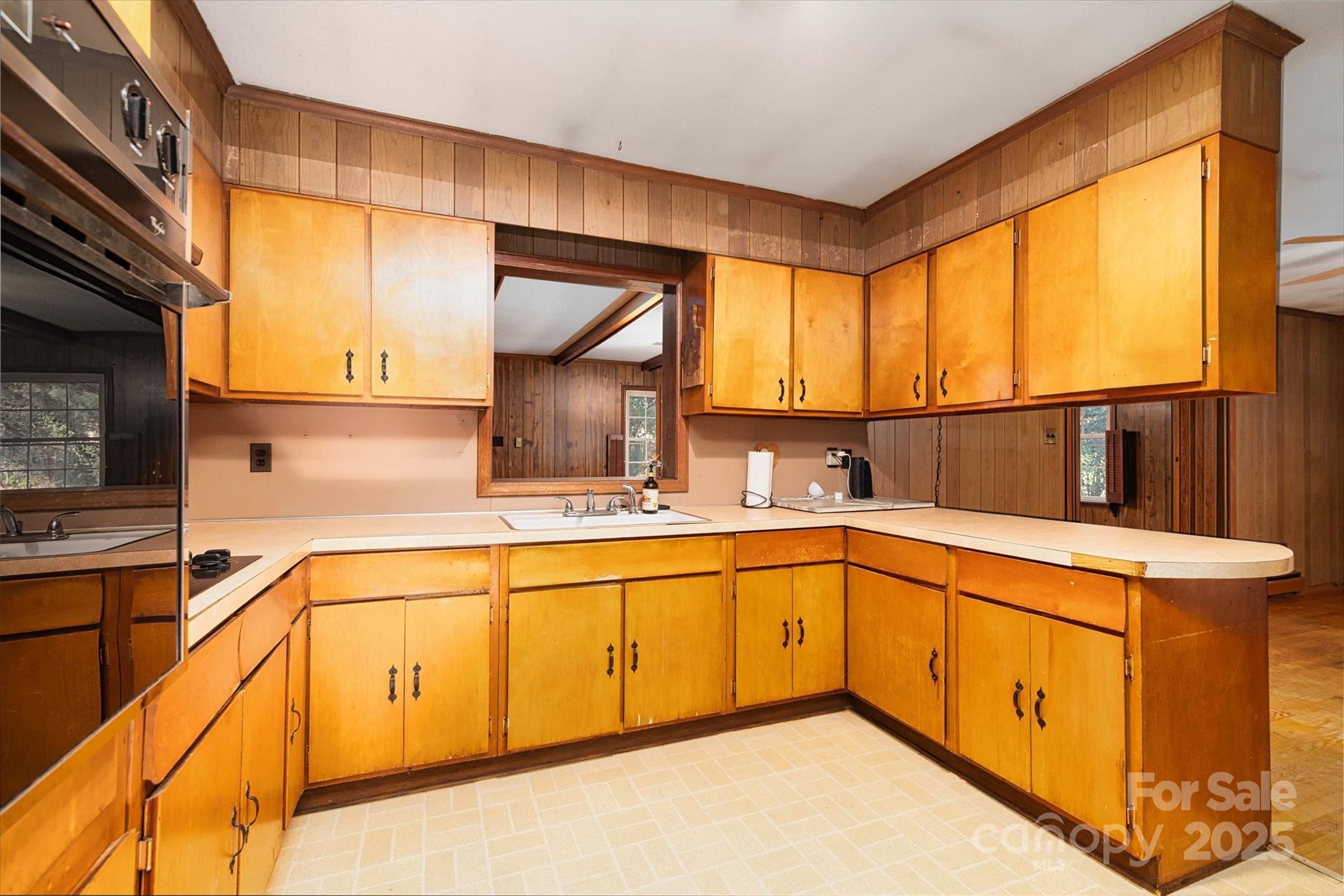 1736 Ebinport Road Rock Hill, SC 29732 - Photo 7 of 35 a kitchen with a sink window and cabinets