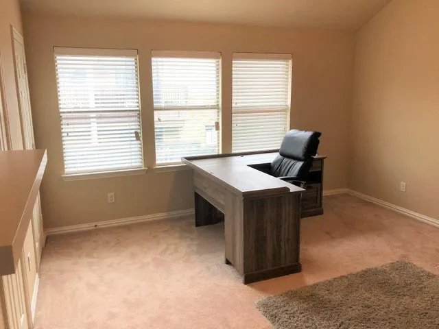 a room with furniture and a window