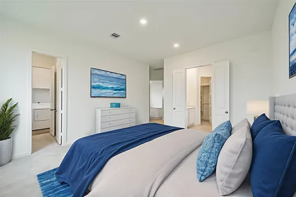 a bedroom with a bed and a couch