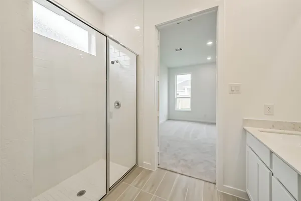 a bathroom with a tub and shower