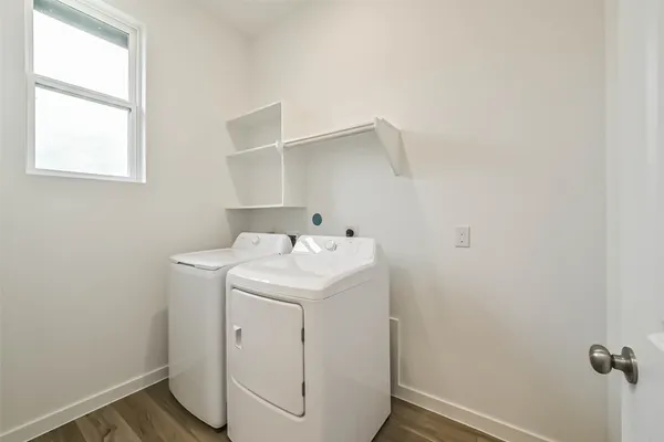 a view of wooden floor and windows in a room