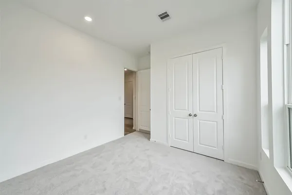 a bathroom with a granite countertop sink a toilet and a bathtub